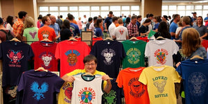 Colourful t-shirts on display at a design contest.