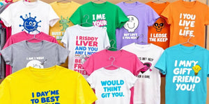 Colourful funny T-shirts on a rack for friends.