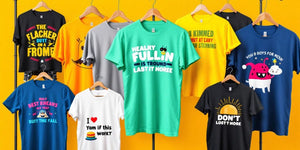 Bright, funny t-shirts displayed on hangers and mannequins.